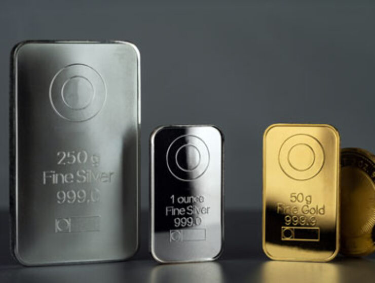 Silver,And,Gold,Bars,And,Coin,On,A,Dark,Background.